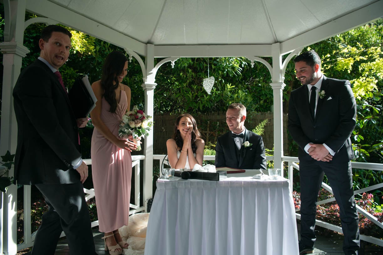 Bride signing the marriage certificate - brisbane wedding photographer