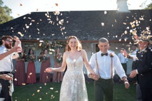 Brisbane couple just finished their ceremony, standing while guests throw flowers over them